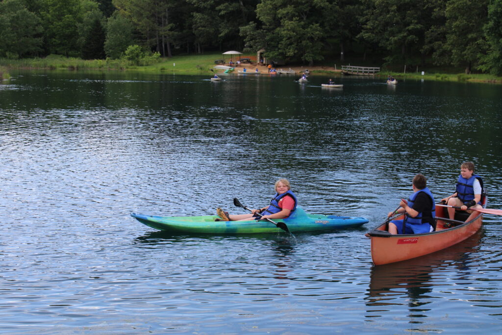 youth kayaking at 4-H camp